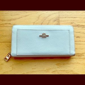 White and gold Coach wallet